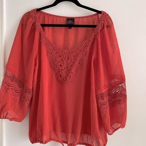 2B Bebe Burnt orange top with crochet details on neck and sleeves